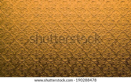 Gold Pattern glass in Thai style of the house window.