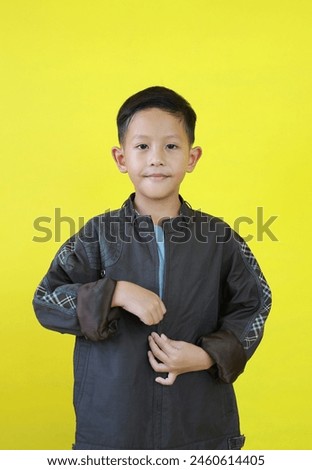 Similar – Image, Stock Photo A boy is putting on a diving mask ready to swim in the sea. White yacht is on the background