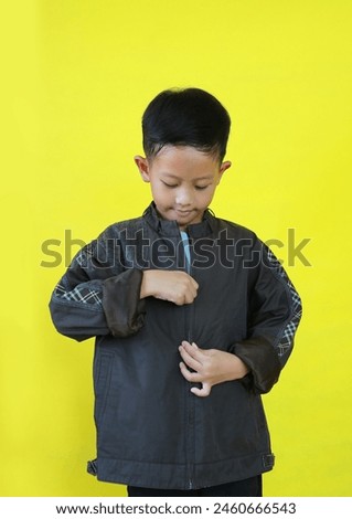 Similar – Image, Stock Photo A boy is putting on a diving mask ready to swim in the sea. White yacht is on the background