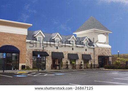 pastel stucco and brick upscale commercial strip mall