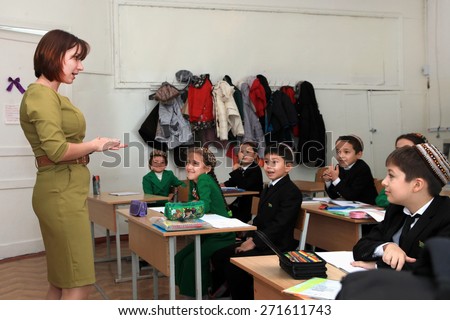 Ashgabad, Turkmenistan - November 4, 2014. Group of students with the teacher  in lesson.  November 4, 2014.  In schools of Turkmenistan annually trains about 900 thousand children.
