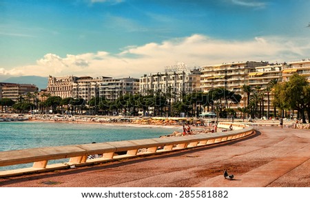 CANNES, FRANCE -  JULY 5, 2014. The beach in Cannes. Cannes located in the French Riviera. The city is famous for its Film Festival. FRANCE, - JULY 5, CANNES 2014