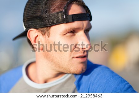 Man in a trucker cap. Outdoor shoot