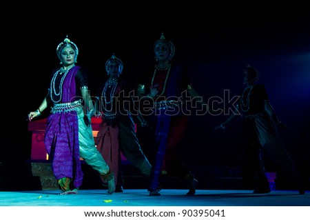 KONARK, INDIA - DECEMBER 04: An unidentified group of lady dancers wears traditional costume and performs Odissi dance at Konark temple on December 04, 2011 in Konark, Orissa, India