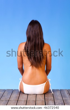 Image, Stock Photo Rear view of topless beautiful woman wearing nothing but straw sun hat realaxing on wild coast of Adriatic sea on a beach in shade of pine tree. Relaxed healthy lifestyle concept.