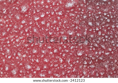 Close-up of a car brake light covered in ice crystals, suitable as a background