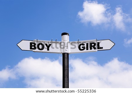 Black and white signpost with Boy and Girl on the directional arrows against a blue cloudy sky.