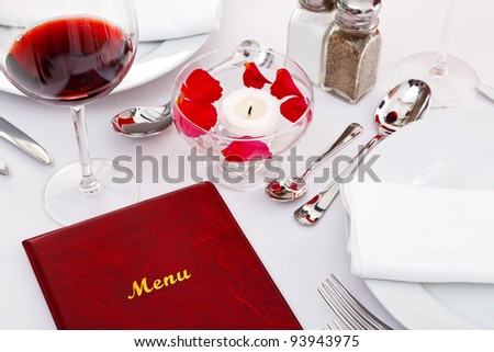 Still life photo of a menu on a restaurant table.