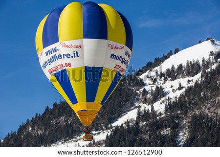 CHATEAU D'OEX, SWITZERLAND - JANUARY 26: Hot air balloons at the 35th International Hot Air Balloon Festival, Switzerland on January 26, 2013 in Chateau d'Oex, Switzerland.
