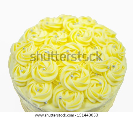 ellow cake frosting over white background