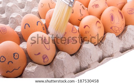 Chicken eggs with drawn face emotions
