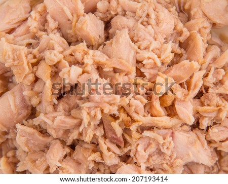 Flaked tuna pieces close up view