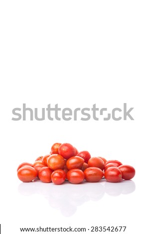 Bite sized red cherry grape tomato over white background
