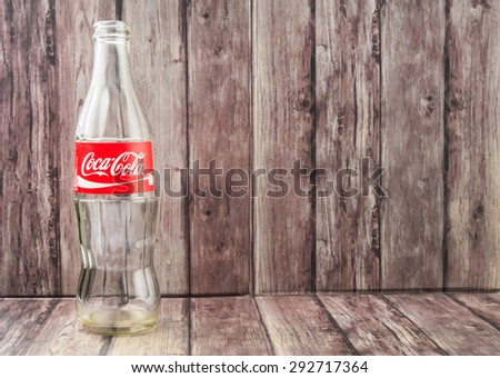 PUTRAJAYA, MALAYSIA - JULY 2ND, 2015. Empty Coca Cola bottle. Coca Cola drinks are produced and manufactured by The Coca-Cola Company, an American multinational beverage corporation.