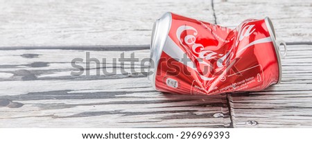 PUTRAJAYA, MALAYSIA - JULY 14TH, 2015. Crumpled Coca Cola cans. Coca Cola drinks are produced and manufactured by The Coca-Cola Company, an American multinational beverage corporation.