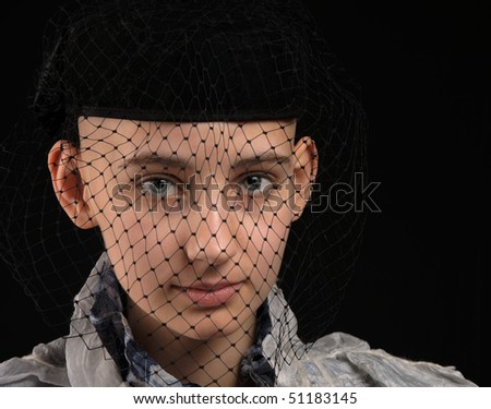 portrait cancer survivor girl with black vintage veil, on black background