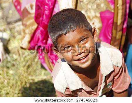 GAYA, INDIA - MARCH 19:  Indian boy smiles and looking camera in a village in India on March 19, 2015 in Gaya, India.