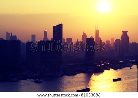 A sunset shot of the Shanghai cityscape and the Huangpu River in Shanghai's Pudong district.