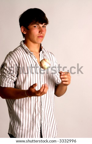 Teenage boy with baseball and wearing white pinstripe shirt