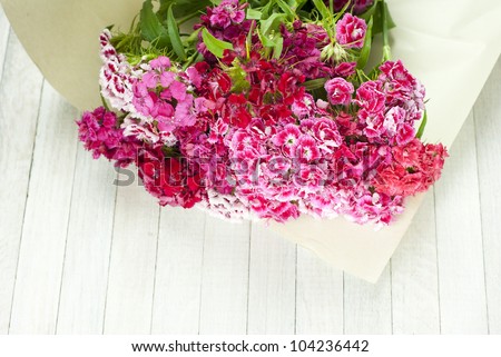 sweet  william bouquet on white wooden table