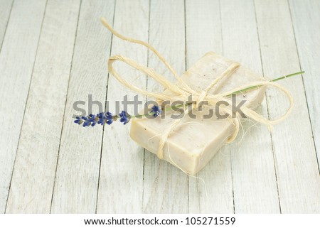 hand made soap with blue lavender flowers, white wooden background
