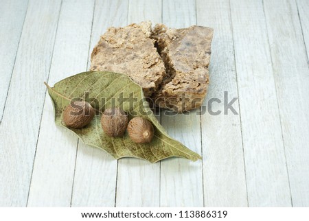 handmade african black soap and ingredients, shea butter nuts, leaf
