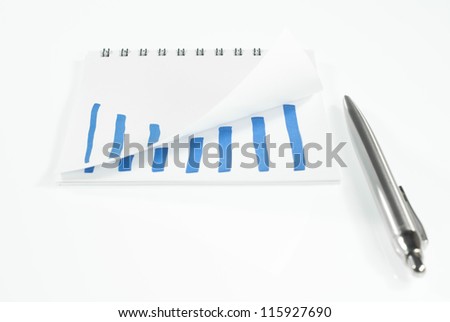 note book with growing graph on white