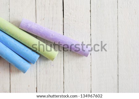 chalks on white wooden table