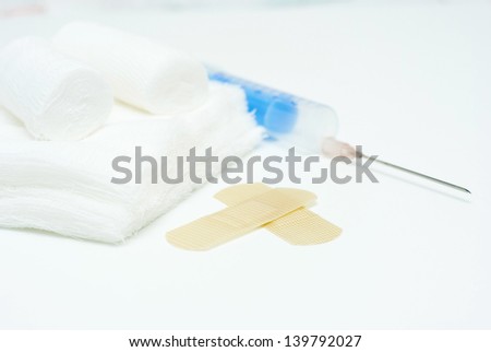 hypodermic needle and accessories, white background