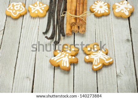 homemade gingerbread cookies with dessert spices on rustic wooden table
