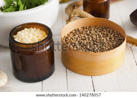 herbs and spices on white wood table