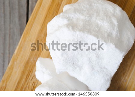 traditional and modern textile washing chemicals on wooden surface