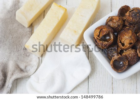 soap nuts natural detergent with dirty and clean baby socks
