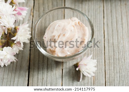 cosmetic cream on old wood background