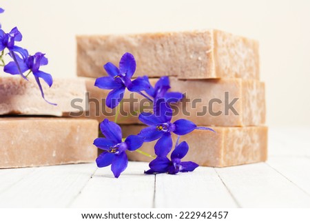 marble pattern homemade soap blocks with flowers on white wooden