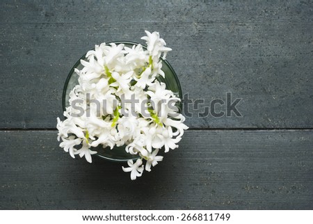 white hyacinth flowers on black wooden table