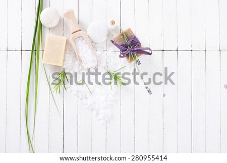 organic soap with lavender flower and bath salt on white wood table