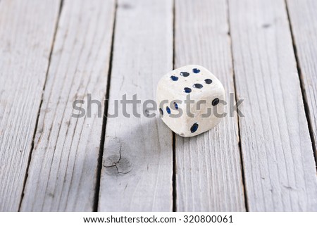dice on old wood table