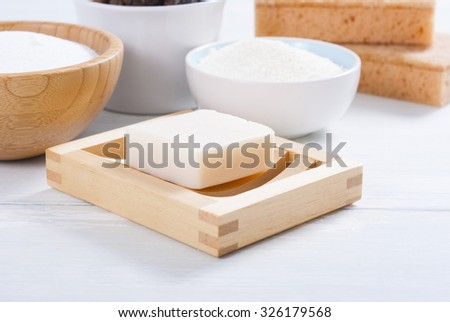soap nuts and other cleaner accessories on white wooden surface