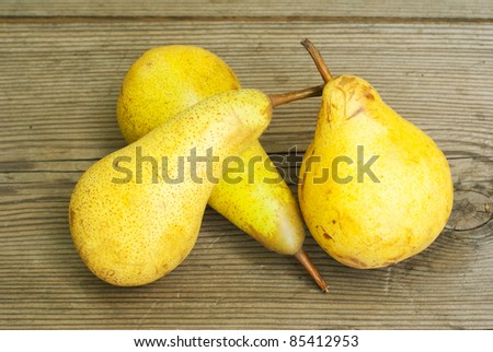 bio pears on rustic wooden table