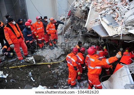 VAN, TURKEY - NOVEMBER 10, 2011: Rescue teams are searching through the buildings destroyed during the earthquake in Van. Van, Turkey. November 10, 2011