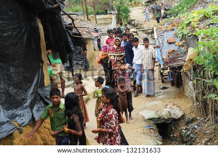 ARAKAN, BANGLADESH - AUGUST 20: Bangladeshi refugee children and women from Arakan go through a hard time in camps, on August 20, 2012 in Arakan, Bangladesh.