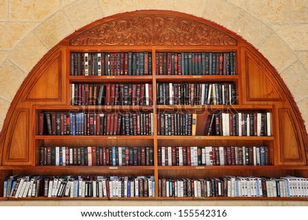 JERUSALEM - AUGUST 21: Jewish sacred books at the entrance to Western Wall prepared to mass prayer during Jewish holidays Rosh Hashanah and Sukkot in Jerusalem, Israel on August 21, 2013.