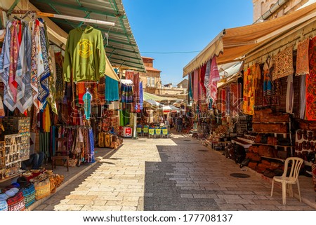 JERUSALEM, ISRAEL - AUGUST 21, 2013: Bazaar in Old City offers middle east traditional products and souvenirs. It is very popular with locals, tourists and pilgrims visiting Jerusalem, Israel.