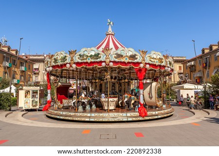 ALBA, ITALY - OCTOBER 02, 2011: Carousel on city square as part of famous annual White Truffle festival and celebrations taking place each year in october in Alba, Italy.