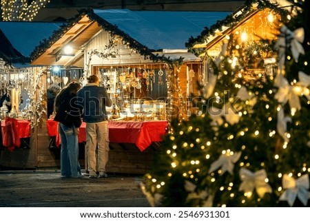 Similar – Image, Stock Photo Christmas market in the late evening with thick snowflakes