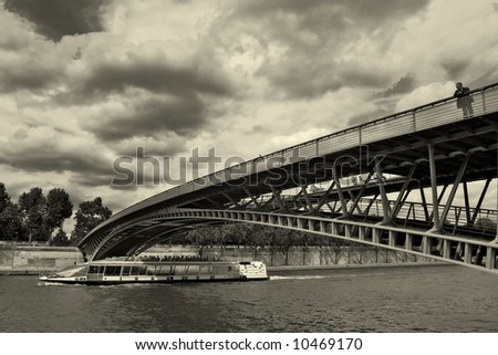 Modern bridge over the Seine river in Paris, France (sepia toned).