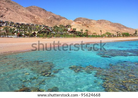 Horizontal oriented image of beautiful Red Sea shoreline and red mountains in Eilat, Israel.