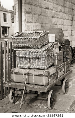 old fashioned luggage cases on cart