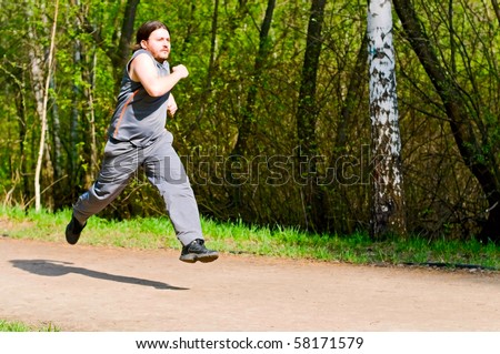 young man running in park